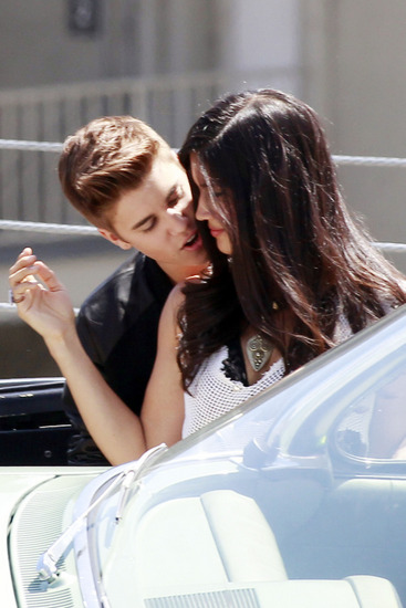 Justin Bieber gets in close with Selena Gomez look a like on the set of his new music video "Boyfriend"